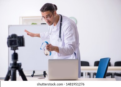 Young male doctor recording video for his blog  - Shutterstock ID 1481951276