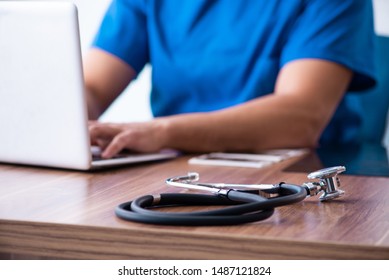 Young male doctor in telehealth concept 