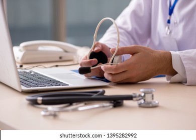Young Male Doctor In Telemedicine Concept 