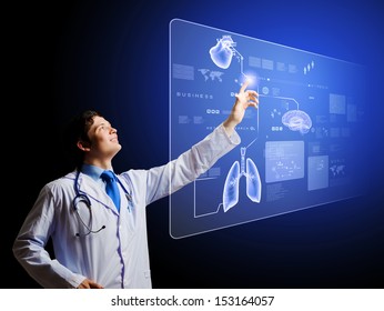 Young Male Doctor Touching Icon On Media Screen