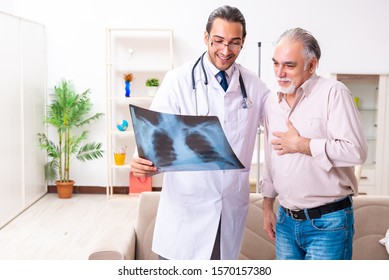 Young Male Doctor Visiting Old Patient At Home