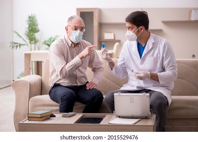 Young male doctor visiting old patient in vaccination concept - Powered by Shutterstock