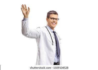 Young Male Doctor Waving Isolated On White Background