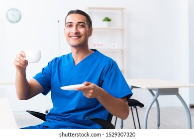 Young male doctor working in the clinic - Shutterstock ID 1529307320
