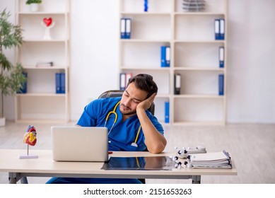 Young Male Doctor Working In The Clinic