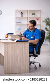 Young Male Doctor Working In The Clinic