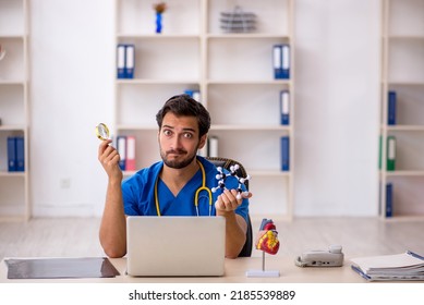 Young Male Doctor Working In The Clinic