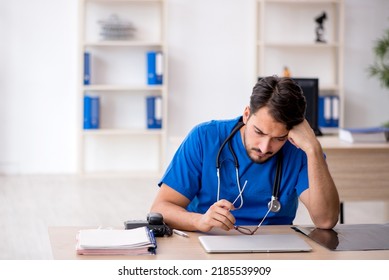 Young Male Doctor Working In The Clinic