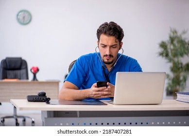 Young Male Doctor Working In The Clinic