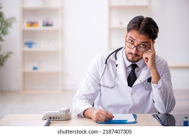 Young Male Doctor Working In The Clinic