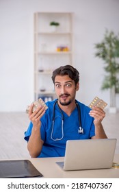 Young Male Doctor Working In The Clinic