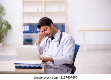 Young Male Doctor Working In The Clinic