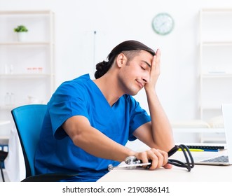 Young Male Doctor Working In The Clinic