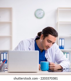 Young Male Doctor Working In The Clinic