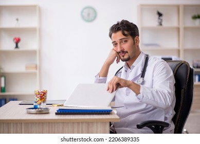 Young Male Doctor Working In The Clinic