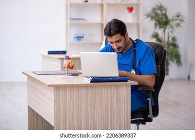 Young Male Doctor Working In The Clinic