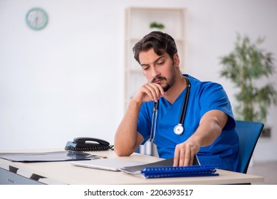 Young Male Doctor Working In The Clinic