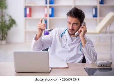 Young Male Doctor Working In The Clinic