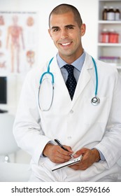 Young Male Doctor Writing Prescription