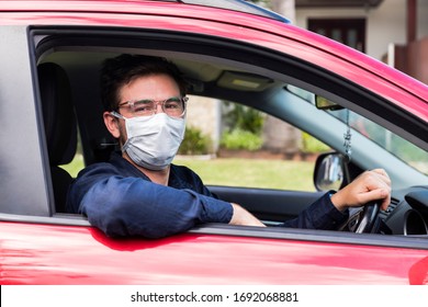 Young Male Driver Inside Car With Protective Face Mask