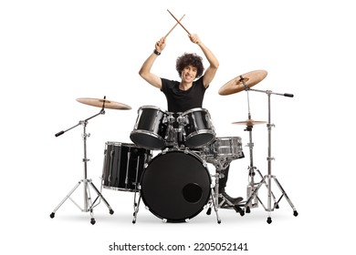 Young male drummer holding drumsticks up isolated on white background