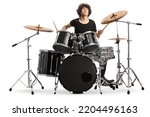 Young male drummer playing on stage isolated on white background