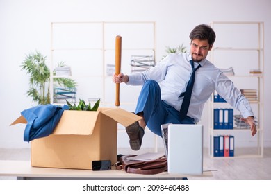 Young Male Employee In Business Relocation Concept