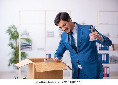 Young Male Employee In Business Relocation Concept