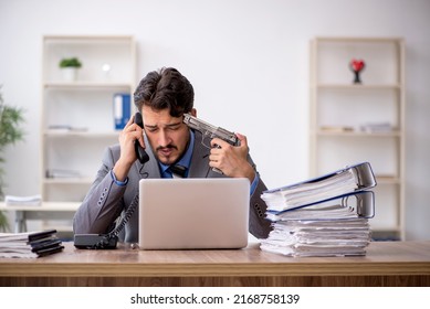 Young Male Employee Committing Suicide In The Office