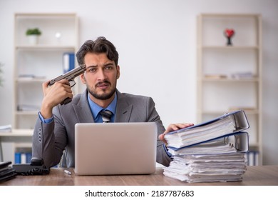 Young male employee committing suicide in the office