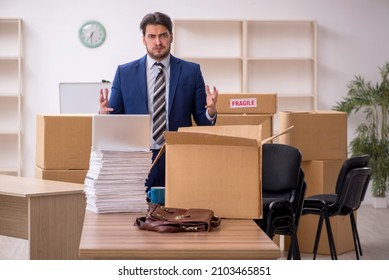 Young Male Employee In Relocation Concept