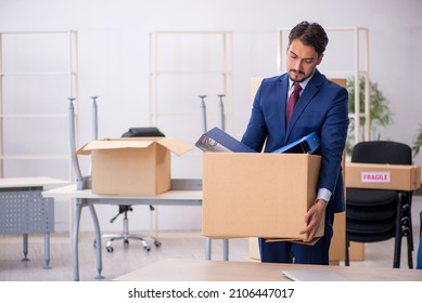 Young Male Employee In Relocation Concept