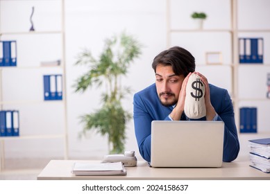 Young male employee in remuneration concept - Shutterstock ID 2024158637