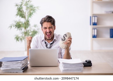Young male employee in remuneration concept - Shutterstock ID 2098447174