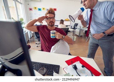 A young male employee in a uniform atmosphere in the office is ready to work after being woke by manager who is yelling at him through the megaphone. Employees, job, office
