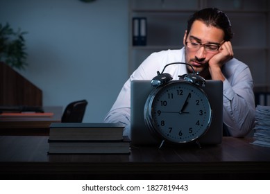 Young Male Employee Working In The Office Night Time