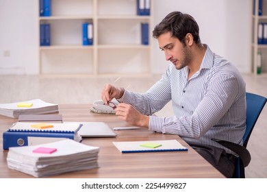 Young male employee working in the office - Shutterstock ID 2254499827