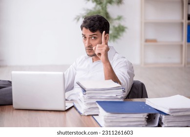 Young male employee working in the office - Shutterstock ID 2311261603