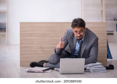 Young male employee working overtime in the office - Shutterstock ID 2092889500
