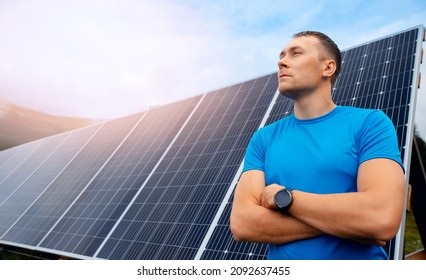 Young Male Engineer Background Solar Panels With Sun Light.