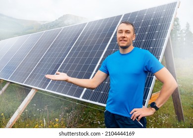 Young Male Engineer Background Solar Panels With Sun Light.