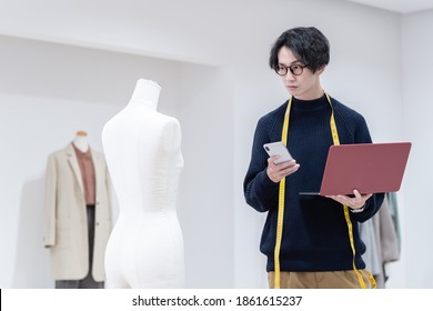 Young Male Fashion Designer Working At Office