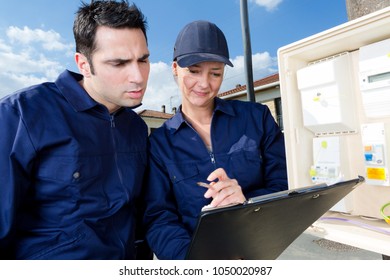 young male and female managers working outdoors