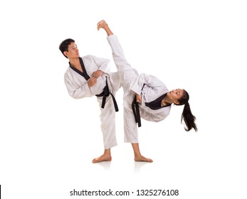 Young Male And Female Taekwondo Black Belt Masters In A Sparring Session. Full Body Shot On White Background