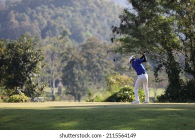 Young male golfer player on golf course