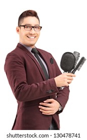 Young Male Hair Stylist Holding Three Hair Brushes, Isolated On White Background