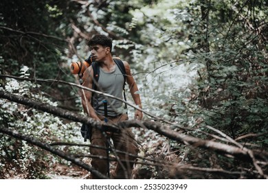 Young male hiker exploring a dense forest on a sunny summer day, enjoying nature and adventure. - Powered by Shutterstock