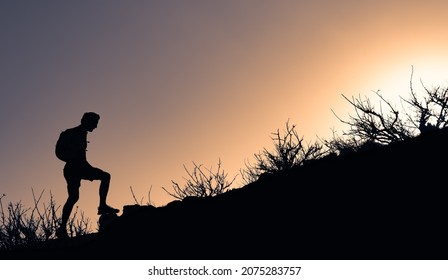 Young Male Hiker Starting His Climb Up A Mountain. 