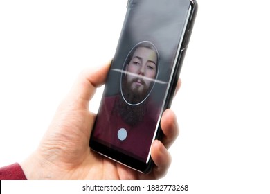 Young male holding mobile phone for scanning face, for changing face to another face technology and fake concept isolated on white background social media