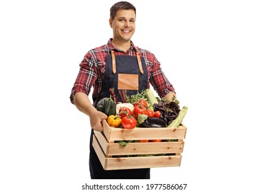 Young Male Market Worker With Vegetables In A Crate Isolated On White Background